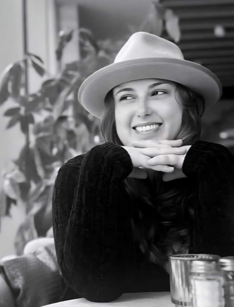 Meghan Michalski smiling, chin resting on her hands